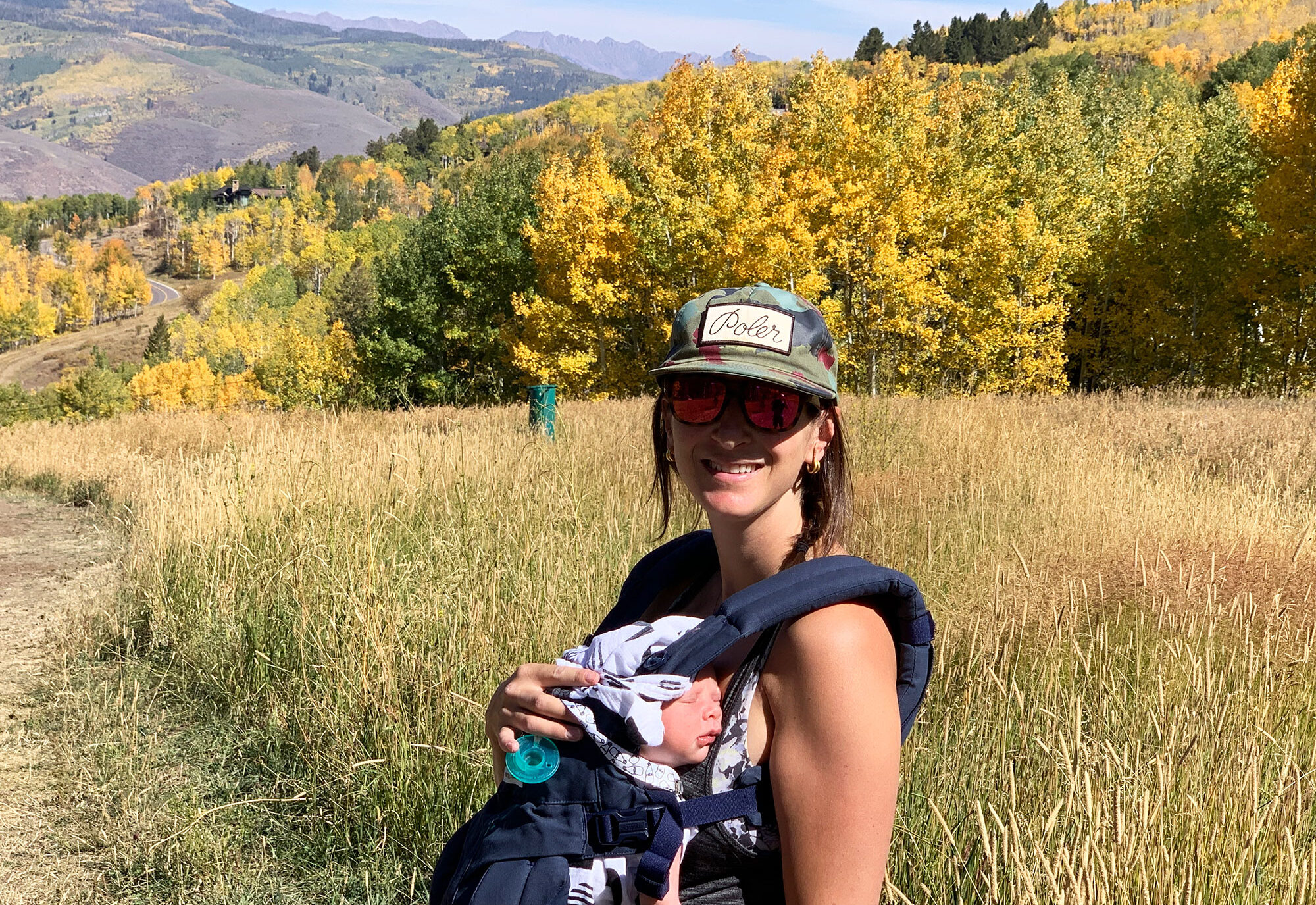 woman hiking in the fall with a baby