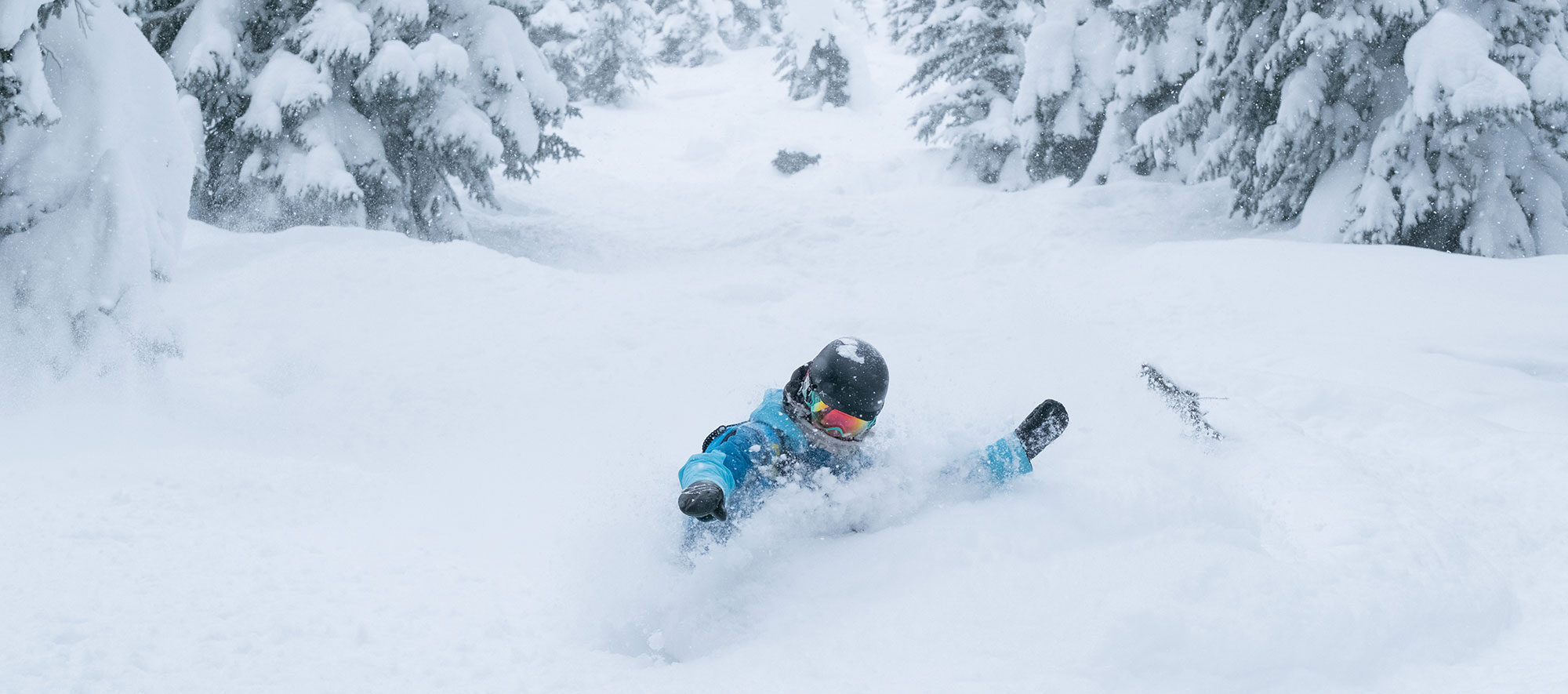 snowboarder tree skiing in beaver creek colorado